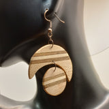 moon and sum inlay wood earrings on model