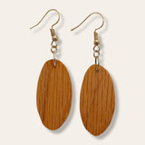 Timeless Elegance: Oval Red Oak Wood Earrings – Handcrafted Artistry for a Distinctive and Nature-Inspired Statement.